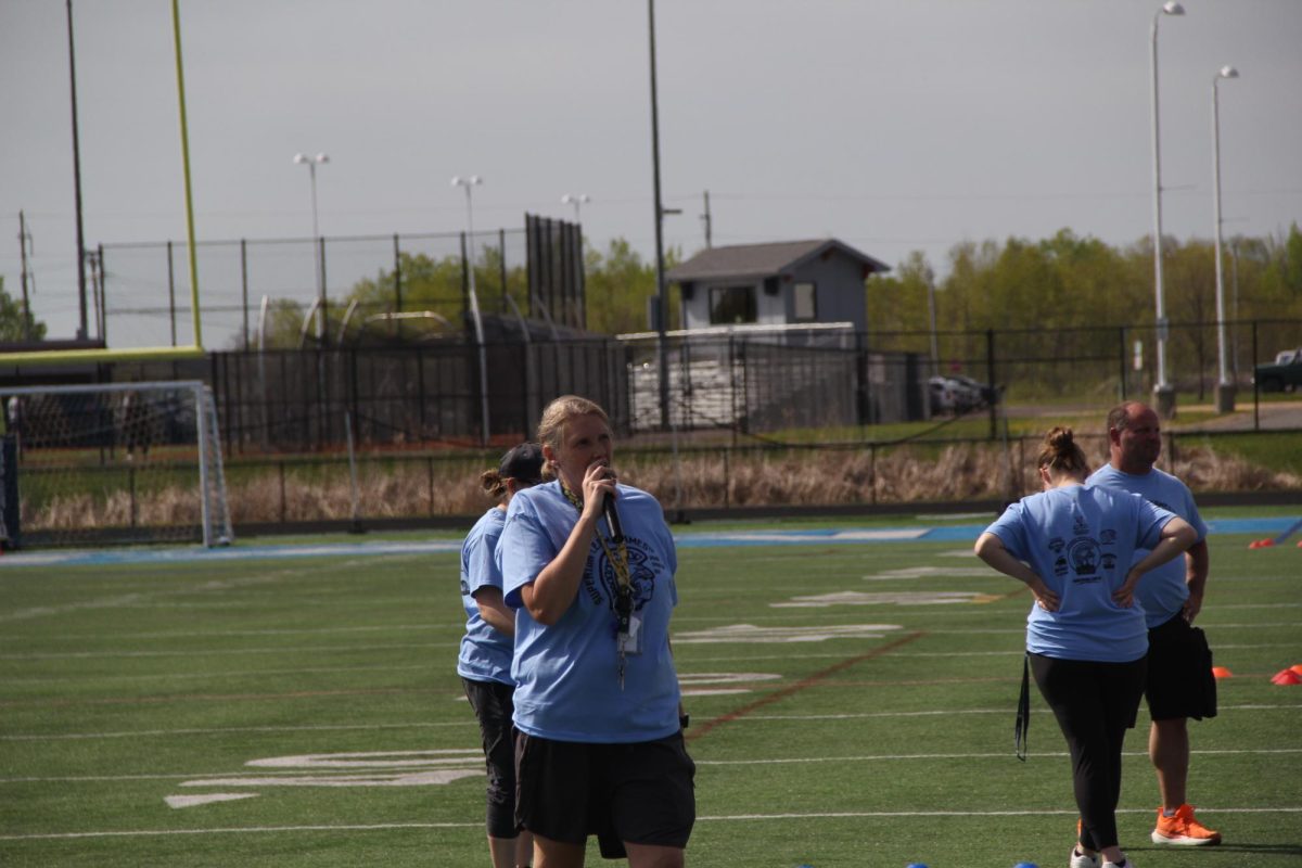  Cooper Physical Education teacher Jamie Peterson gives motivational speech to the students before the start of fifth grade team day at the NBC Spartan Sports Complex on May 26, 2026.  