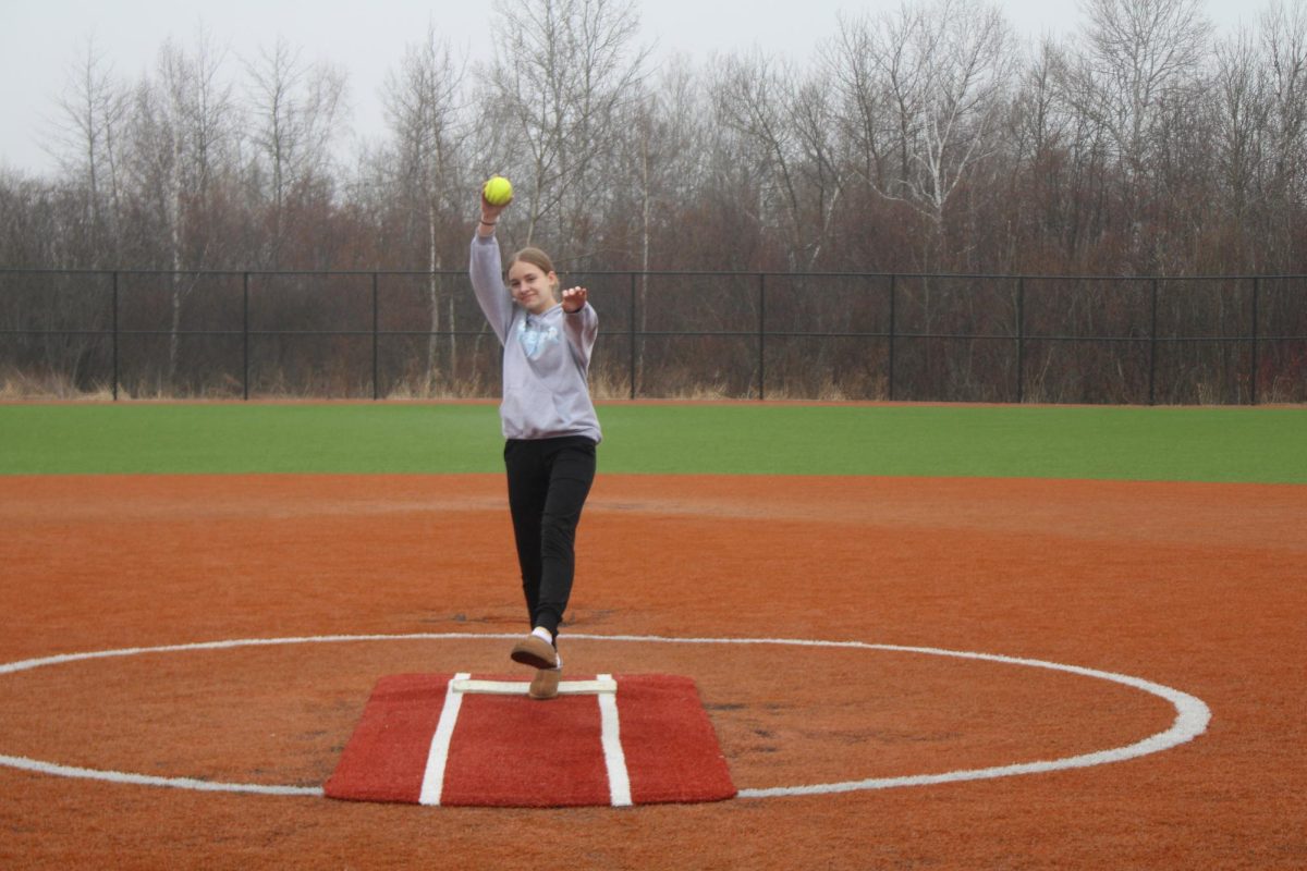 Sophomore Tenley Lawton practices pitching a softball at the SHS softball field. 