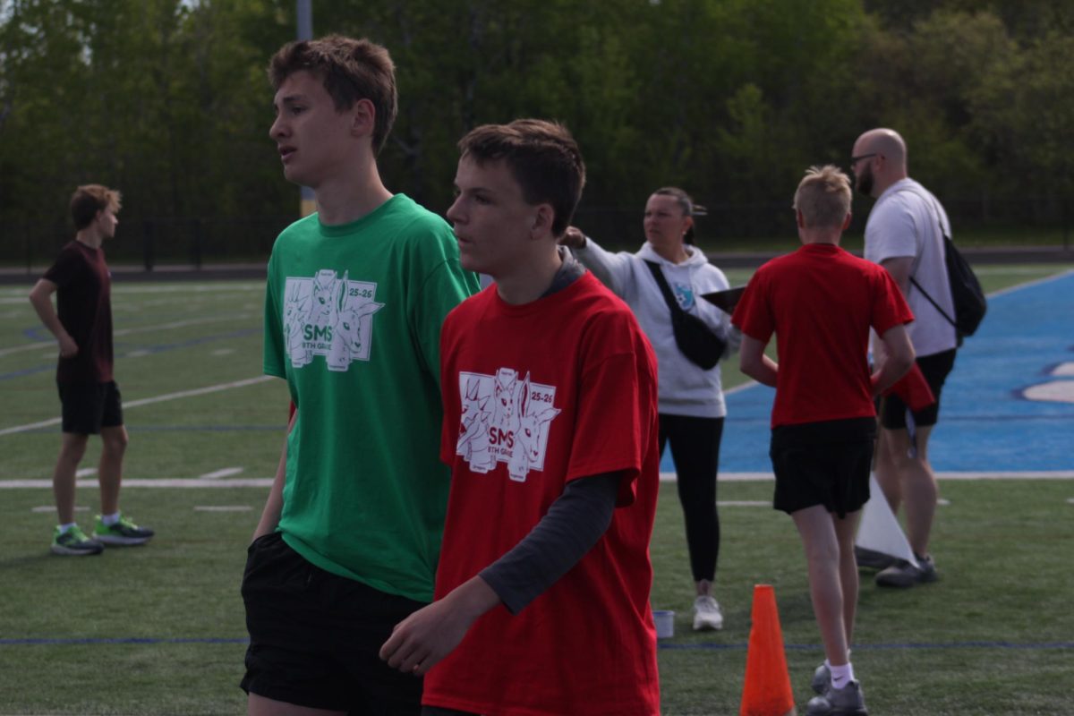 Eighth grade students walk together after finishing their race at the NBC Spartan  Sports Complex on June 1. 
