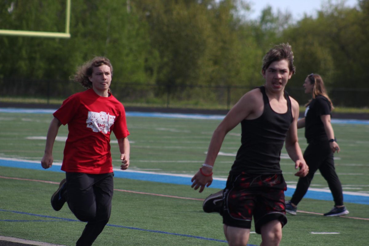 Eight graders run to the finish line during Track-O-Rama on June 1 at the NBC Spartan Sports Complex. 