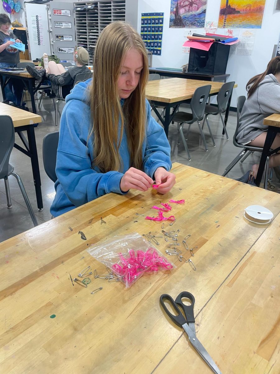 Senior Isabel Carlson works on ribbons in Olivia White’s art room on May 27, 2026. The ribbons were created in memory of a Superior High school student who had passed earlier in the 2025-2026 school year. 