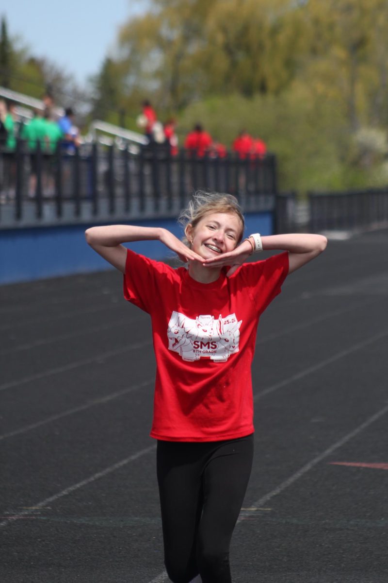 Eighth grade Emmarae Soyring celebrates after running the 400 meter dash during Track-O-Rama on June 1 at the NBC Spartan Sports Complex